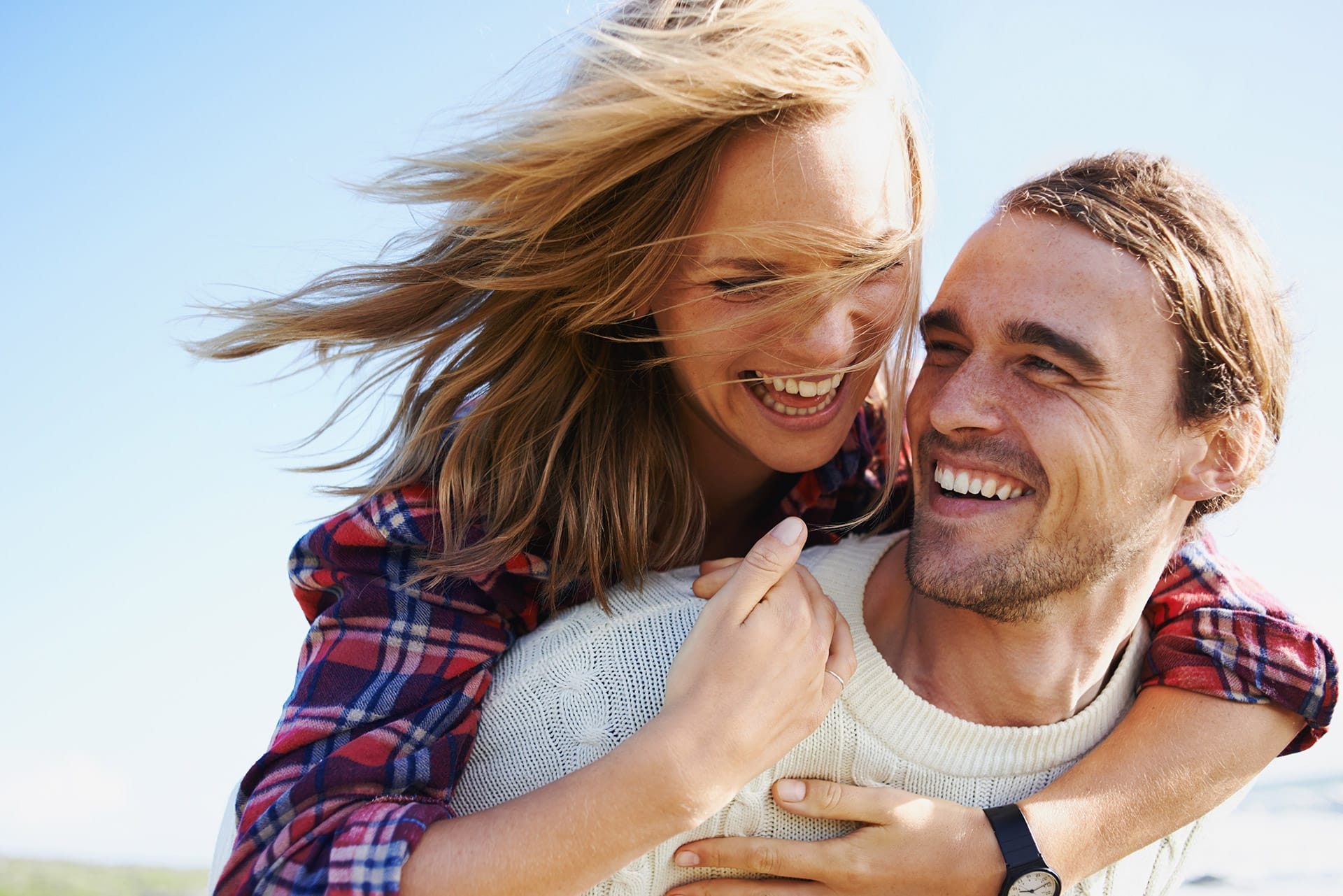 Woman getting a piggyback ride from man