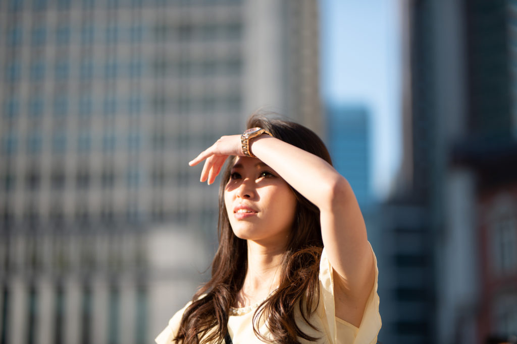 Woman shading her eyes from sun