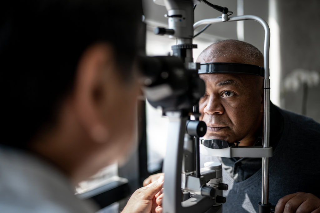 Older man getting eye exam