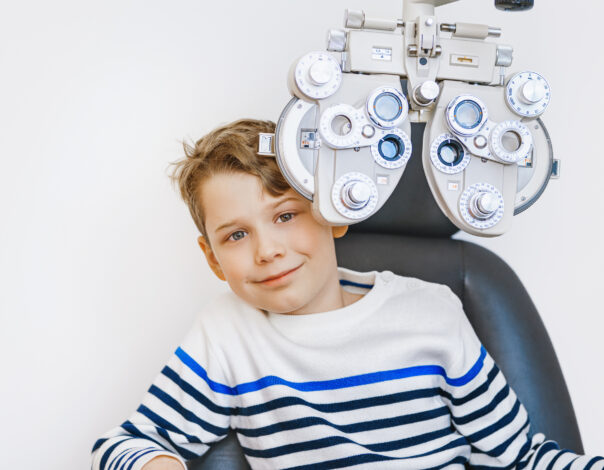 A school child doing eye test in clinic